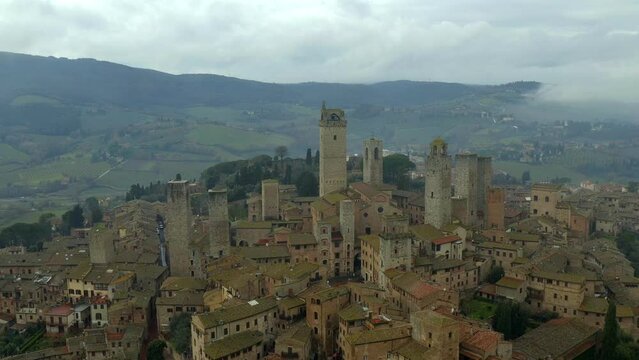 Drone aerial view of San Gimignano with iconic castle towers in Tuscany, Italy