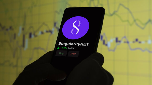 December 04th 2023. An investor analyzing the price of SingularityNET on a phone, the token coin $AGIX on a crypto exchange sreen.