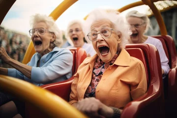 Deurstickers an elderly enjoying at the amusement park  © cristian