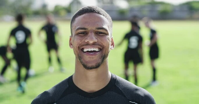 Rugby training, man and fitness or face for sports on field, confidence and ready for game at stadium. Male person, athlete and smile for exercise in outdoors, practice and pride in portrait or happy