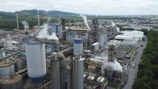 aerial view of smoke coming from chimneys at a pulp and paper industry in Brazil