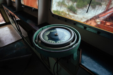 Old compass in abandoned ship