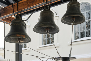 bells and religious symbols made from metal 