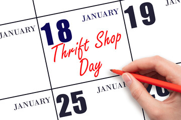 January 18. Hand writing text Thrift Shop Day on calendar date. Save the date.