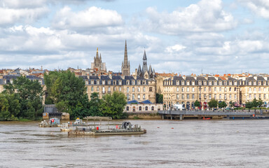 Fototapeta premium Bordeaux, France. Panoramic view of the city with Saint Michel cathedral over the river Garonne.