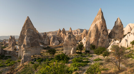 eroded volcanic rock formations, the fairy chimneys in the evening lights, Cappadocia, Turkey
