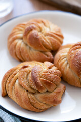Traditional Swedish cardamom buns kardemummabullar made of yeast dough
