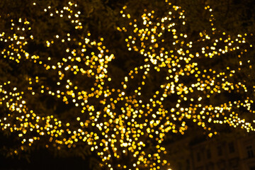 Christmas decorations on the street, colorful holiday bokeh lights, city night illumination,...