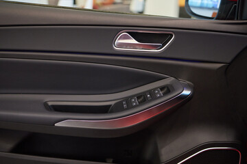 Buttons to lock and unlock the locks on the driver's door of a new modern premium car
