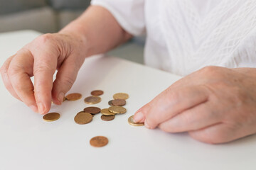 Crop woman counting euro coins