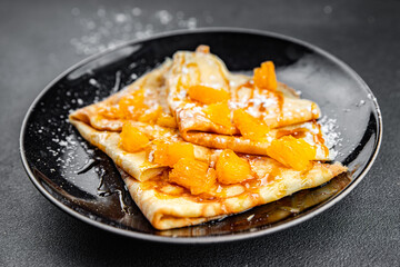crepe pancake orange and syrup fresh delicious healthy eating cooking appetizer meal food snack on the table copy space