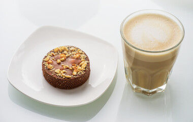 Cappuccino with tart on white background