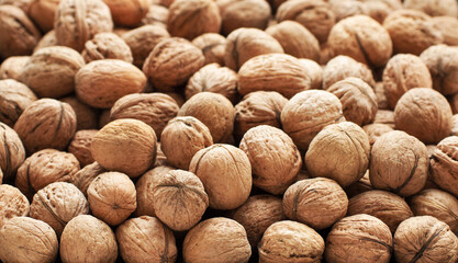 Top view of whole walnuts as background texture
