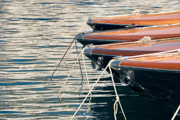 Few luxury retro motor boats in row at the famous motorboat exhibition in the principality of...