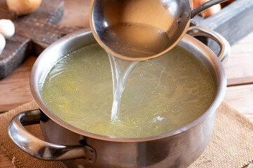 Homemade golden vegetable Beef Bone Broth full of nutrition and health benefits.
