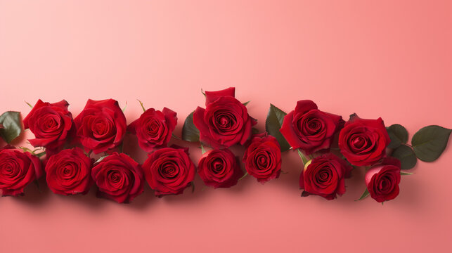 Serene top view of red roses carefully arranged on a pastel red backdrop, providing a delightful and visually appealing image with copyspace,