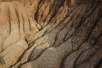 Dired out soil on the red and yellow rock formations in the Tatacoa Desert, Desierto de la Tatacoa,...