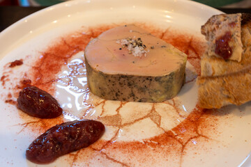 Foie gras fat liver specialty food product made of liver of a duck or goose fattened by gavage, force feeding, served in restaurant with strawberry jam