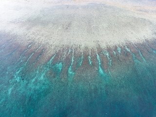 Seen from a bird's eye view spur and groove channels are found on a shallow coral reef on Ambon,...