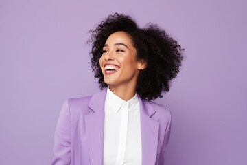 Portrait of happy african american businesswoman in violet suit