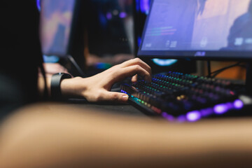 Cyber sport e-sports tournament, team of professional gamers, hands on a mouse and keyboard,...