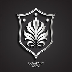 3d silver shield with decorative floral ornament logo