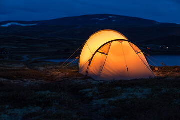 Iluminated tent at night in Norway