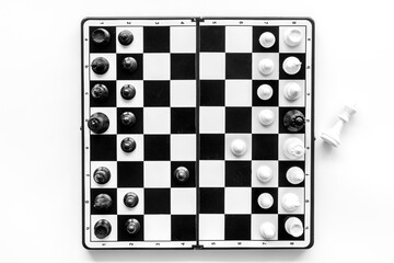 Chessboard with chess pieces, top view. Challenge and leadership concept