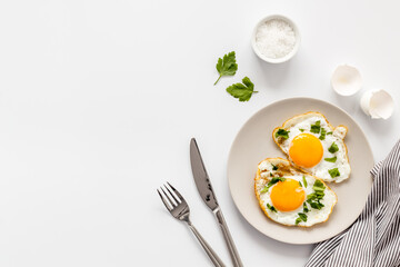 Cooking fast breakfast with fried eggs, top view. Food background