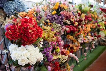 artificial flowers prepared for sale on display in shop