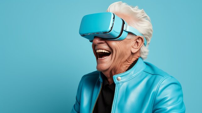 Senior male enjoying immersive virtual reality experience with vr goggles on a solid background