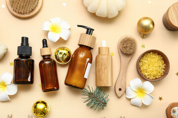 Composition with cosmetic products, spa accessories and Christmas decorations on color background