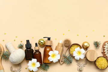 Composition with cosmetic products, spa accessories and Christmas decorations on color background