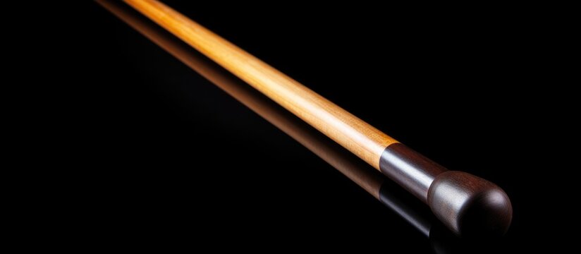 billiard sticks on a black background