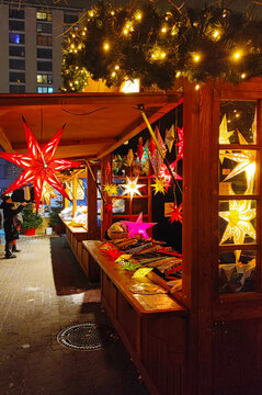 Illuminated stall with souvenirs at Christmas Market at Berlin City Hall near Alexanderplatz (Weihnachtsmarkt am Roten Rathaus)