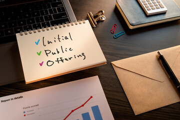 There is notebook with the word Initial Public Offering. It is an abbreviation for Initial Public...