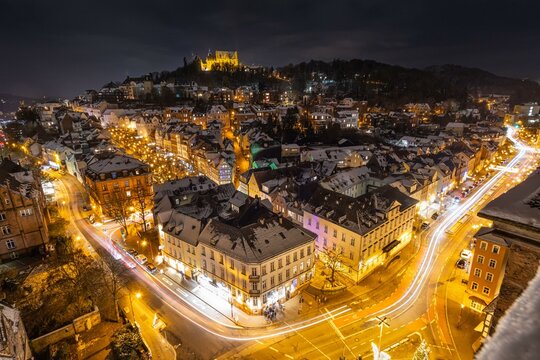 The lights of the snow-covered town of Marburg an der Lahn glow in the evening, Wetterau, Marburg, Hesse, Germany, Europe