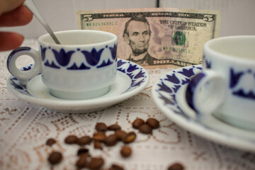 coffee cups and dollar notes