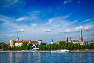 View of Riga over Daugava river: Riga Castle, St. James's Cathedral, St. Peter's Church. Riga,...
