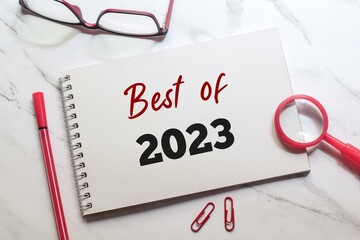 Best of 2023 written in notepad on desk. Year in review, best events of the year concept.