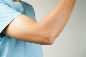 Health concept, person with elbow pain, man holding hand on elbow with pain, bone arthritis