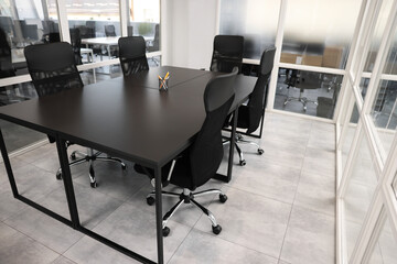 Comfortable office chairs and tables in meeting room