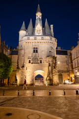 Fototapeta na wymiar Night view of the Porte Cailhau or Porte du Palais. The former town gate of the city of Bordeaux in France. One of the main touristic attractions of the French city. High quality photography.