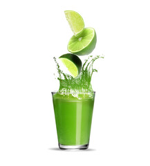 Juice splashing from glass on white background. Cut lime falling into drink