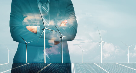 Double exposure graphic of business people working over wind turbine farm and green renewable energy worker interface. Concept of sustainability development by alternative energy. uds - obrazy, fototapety, plakaty