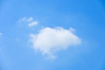beautiful blue sky and white fluffy single cloud with sunrise in the morning, natural background