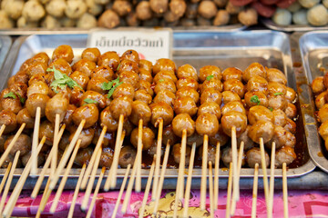 Grilled skewers meatball with spicy tamarind sauce served on plate