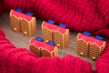 The scarf surrounds the commercial housing model for heating