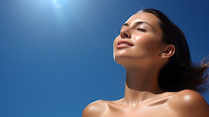 Beautiful caucasian woman with healthy perfect face skin enjoying sunbathing