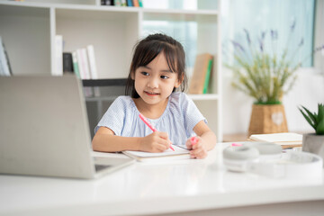 Photo of young Asian baby girl studying at home - obrazy, fototapety, plakaty